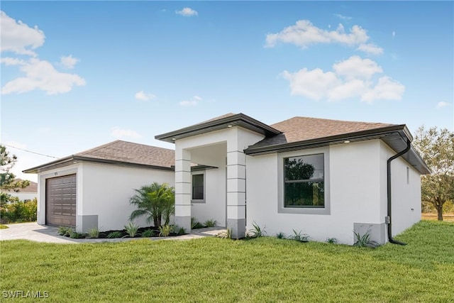 view of front facade featuring a front yard and a garage