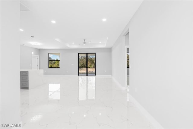 spare room featuring a raised ceiling