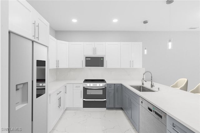 kitchen with pendant lighting, gray cabinets, and white cabinetry