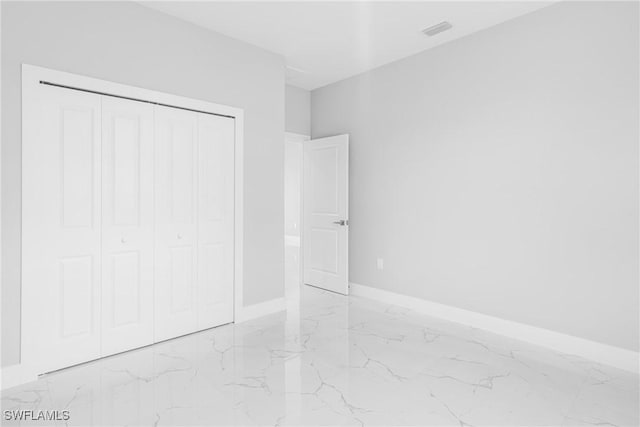 unfurnished bedroom featuring a closet