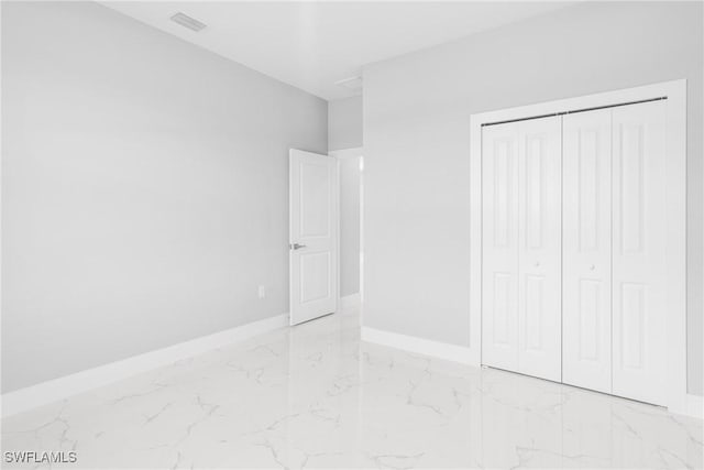 unfurnished bedroom featuring a closet