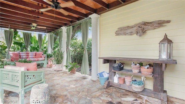 sunroom featuring beam ceiling