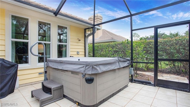 sunroom / solarium with a jacuzzi and a healthy amount of sunlight