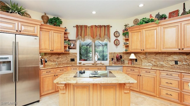 kitchen with appliances with stainless steel finishes, tasteful backsplash, light stone counters, sink, and a kitchen island