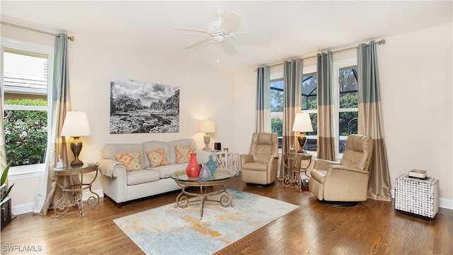 living room featuring hardwood / wood-style flooring and ceiling fan