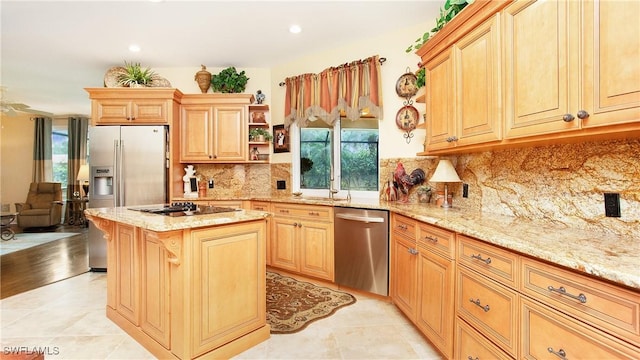 kitchen with a center island, light stone counters, decorative backsplash, light tile patterned floors, and appliances with stainless steel finishes