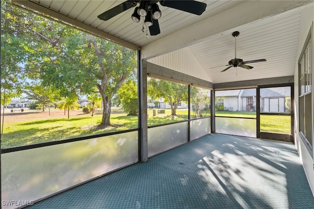 unfurnished sunroom with ceiling fan and lofted ceiling