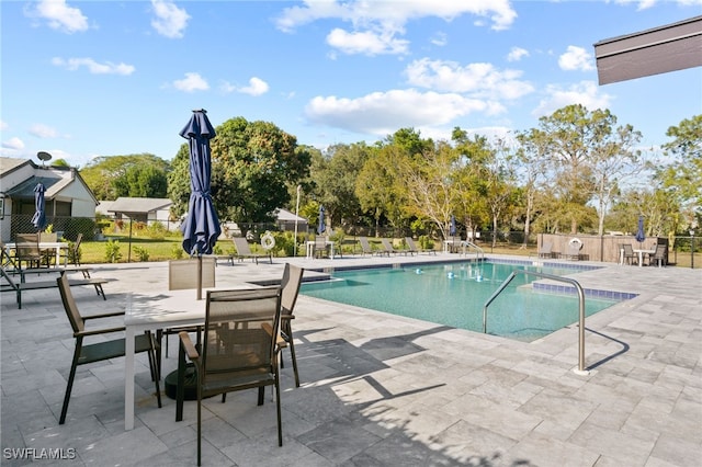 view of swimming pool featuring a patio