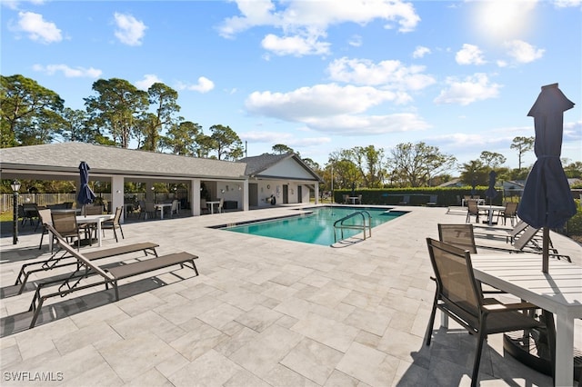 view of swimming pool with a patio