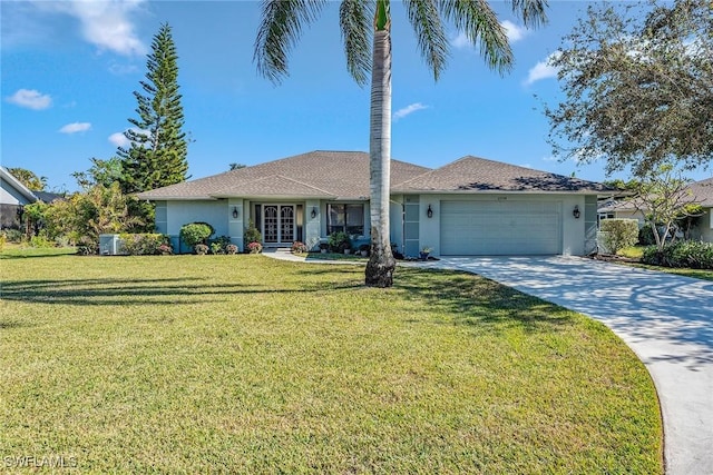 ranch-style house featuring cooling unit, a garage, and a front yard