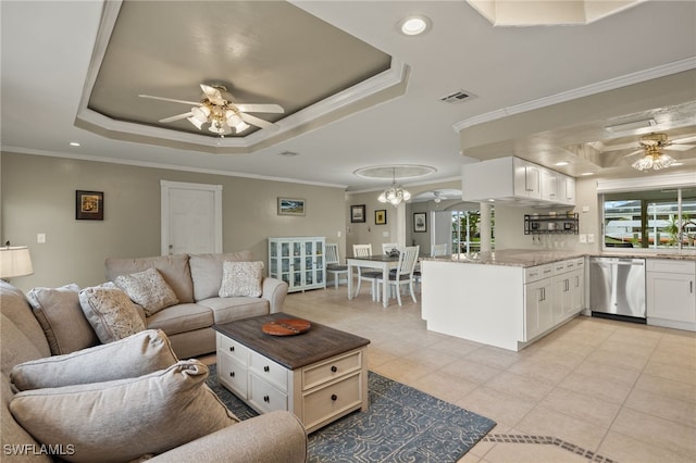 tiled living room with ceiling fan with notable chandelier, crown molding, and a healthy amount of sunlight