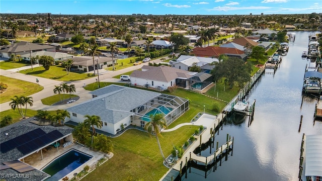 drone / aerial view with a water view