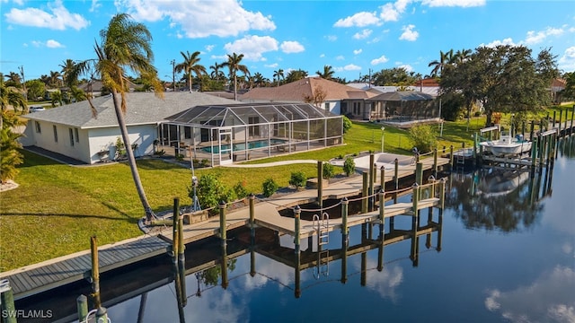 dock area featuring a water view, a lanai, and a lawn