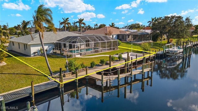 view of dock featuring a yard, a water view, and a lanai