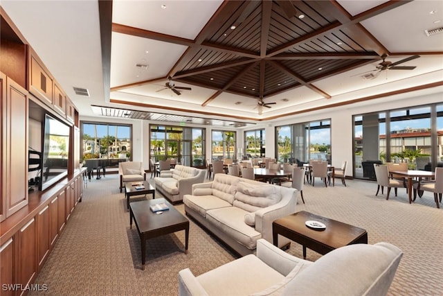 living room featuring carpet flooring, ceiling fan, beam ceiling, and coffered ceiling