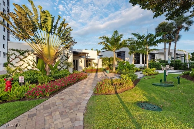 view of home's community featuring a lawn