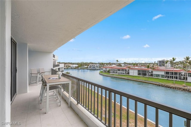 balcony featuring a water view