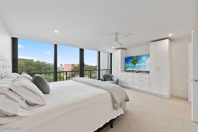 carpeted bedroom featuring ceiling fan and access to exterior