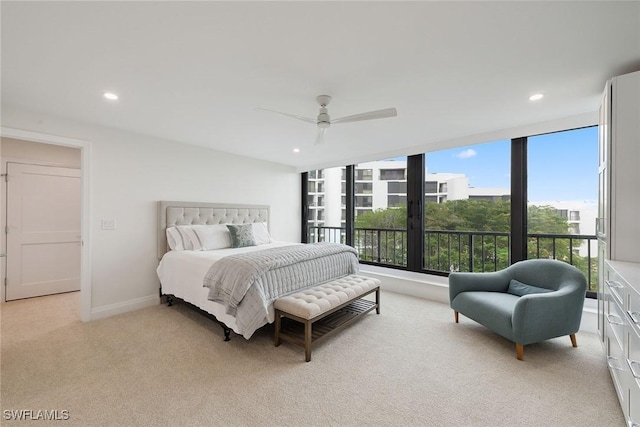 bedroom featuring light carpet and ceiling fan