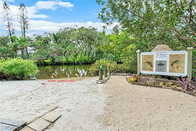 view of home's community with a water view