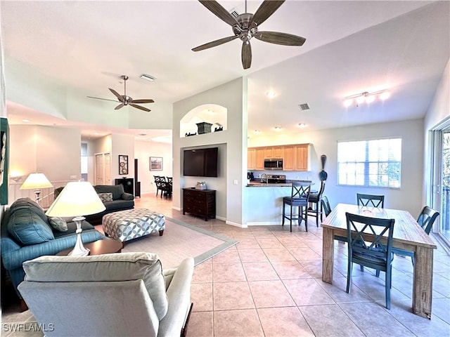 living room featuring ceiling fan and light tile patterned floors