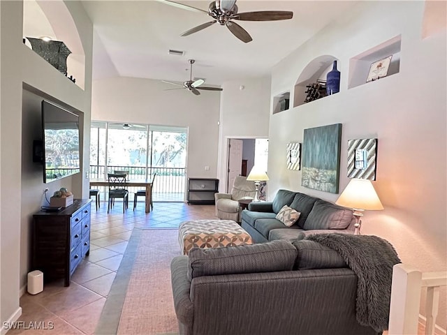 living room with high vaulted ceiling, tile patterned floors, and ceiling fan