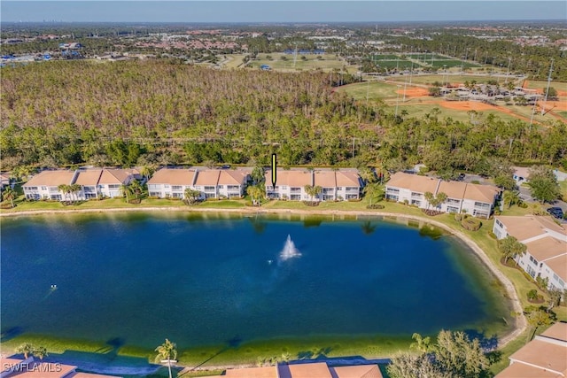 drone / aerial view with a water view and a residential view