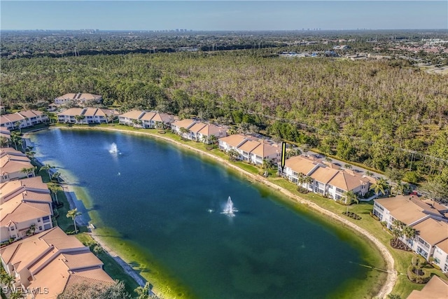 aerial view featuring a water view, a forest view, and a residential view