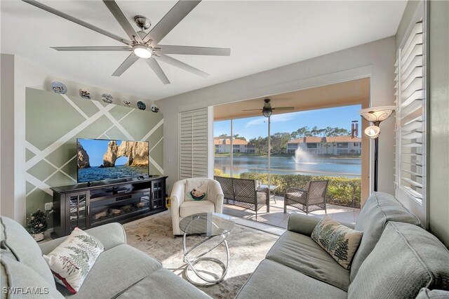 living room featuring a ceiling fan