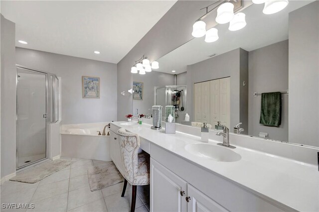 full bath with a garden tub, tile patterned flooring, a shower stall, and vanity