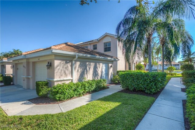 view of side of property with a garage