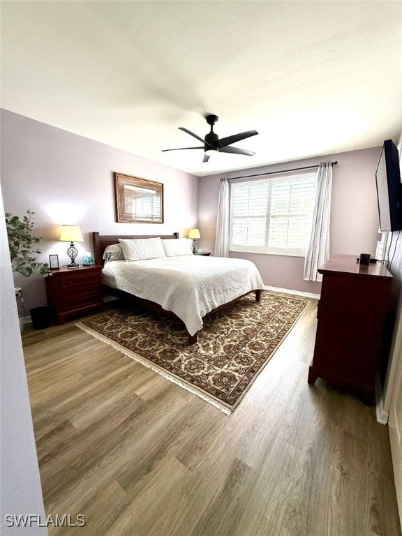 bedroom featuring a ceiling fan and wood finished floors