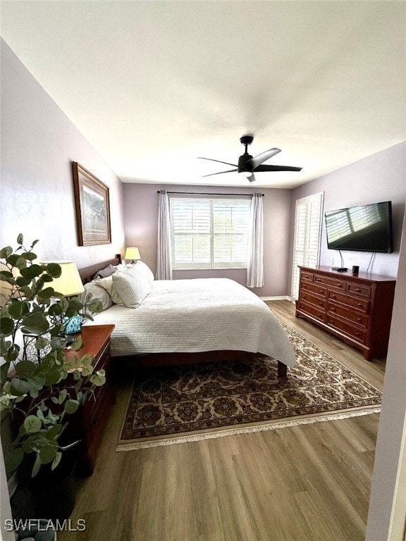 bedroom with a ceiling fan and wood finished floors