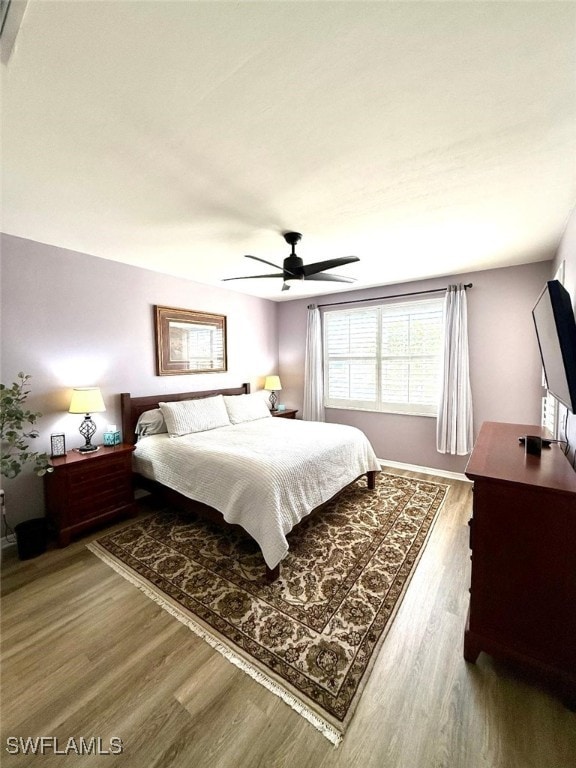 bedroom featuring ceiling fan and wood finished floors