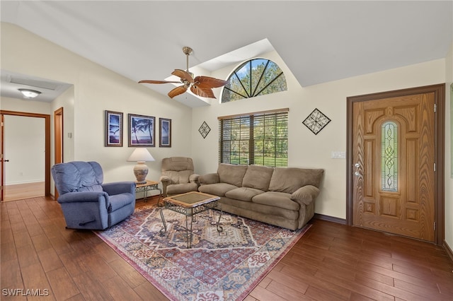 living room featuring ceiling fan, hardwood / wood-style floors, and vaulted ceiling