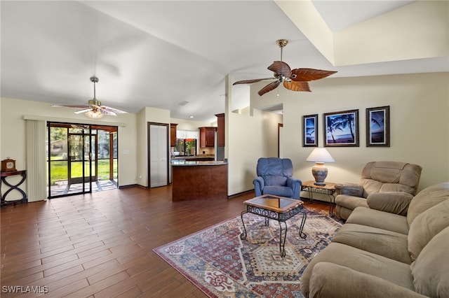 living room featuring lofted ceiling, ceiling fan, and dark wood-type flooring