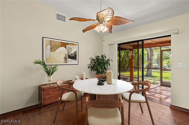 dining room with dark hardwood / wood-style flooring and ceiling fan