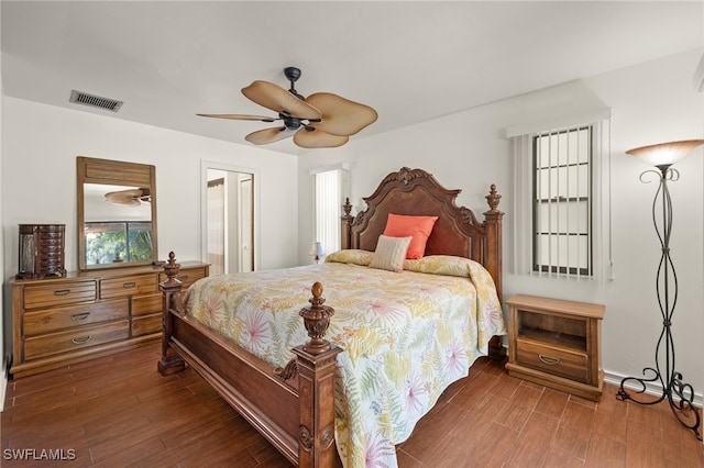 bedroom with ceiling fan and dark hardwood / wood-style flooring