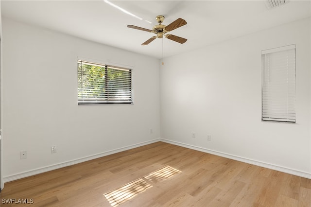 unfurnished room with light hardwood / wood-style floors and ceiling fan