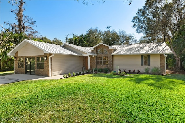 ranch-style home with a front yard and a carport