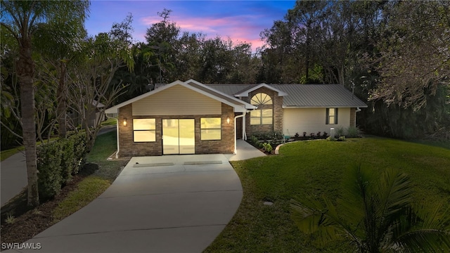 ranch-style house with a yard