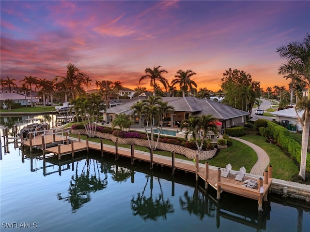 exterior space with a lawn and a water view