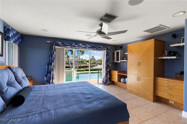 bedroom with access to exterior, ceiling fan, and light tile patterned floors