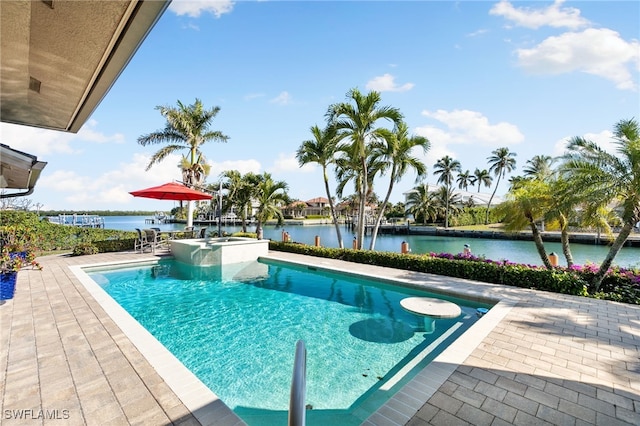 view of pool featuring a patio area and a water view