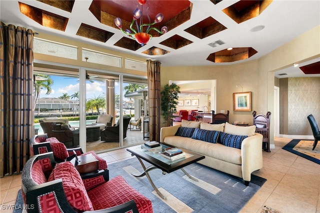 living room featuring beam ceiling, light tile patterned floors, and coffered ceiling