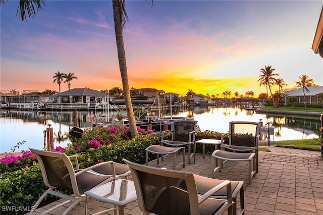 exterior space with a water view and a boat dock