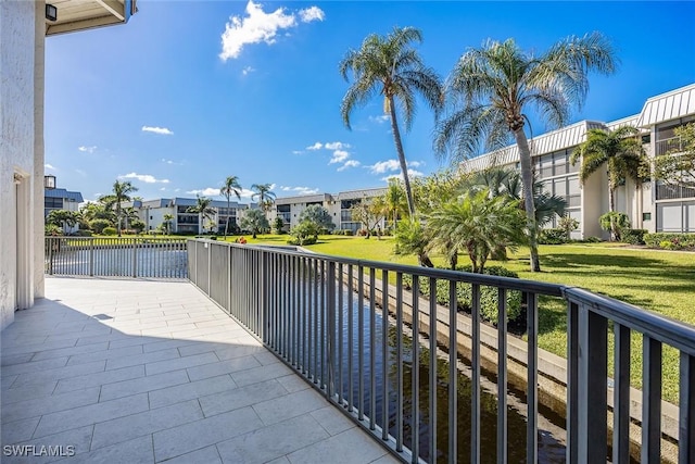 balcony featuring a water view