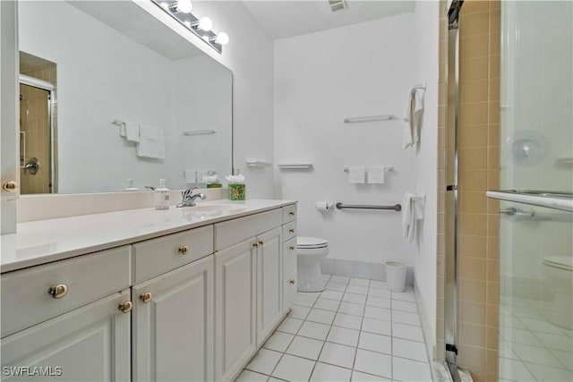 bathroom featuring walk in shower, tile patterned flooring, and toilet