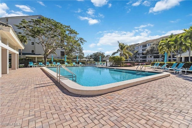 view of pool featuring a patio