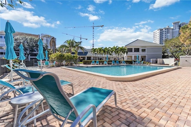 view of swimming pool with a patio